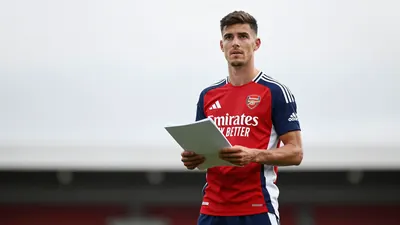A mid-30s anonymous Arsenal midfielder, lean build, waist-up, face sharply focused, eyes bright, hair short, expression...