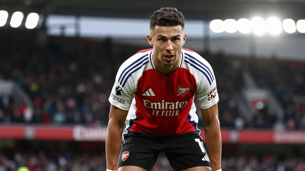 A photorealistic image of an anonymous Arsenal player in a red jersey with white sleeves, black shorts, and white socks...