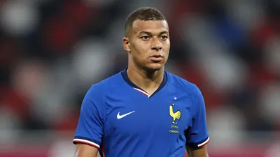 A photorealistic image of an anonymous 23-year-old player with a France international cap, wearing a clean, blue...