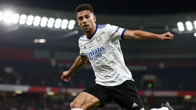 A photorealistic image of an anonymous Arsenal player, aged 25-30, in a white jersey with a blue collar, black shorts...