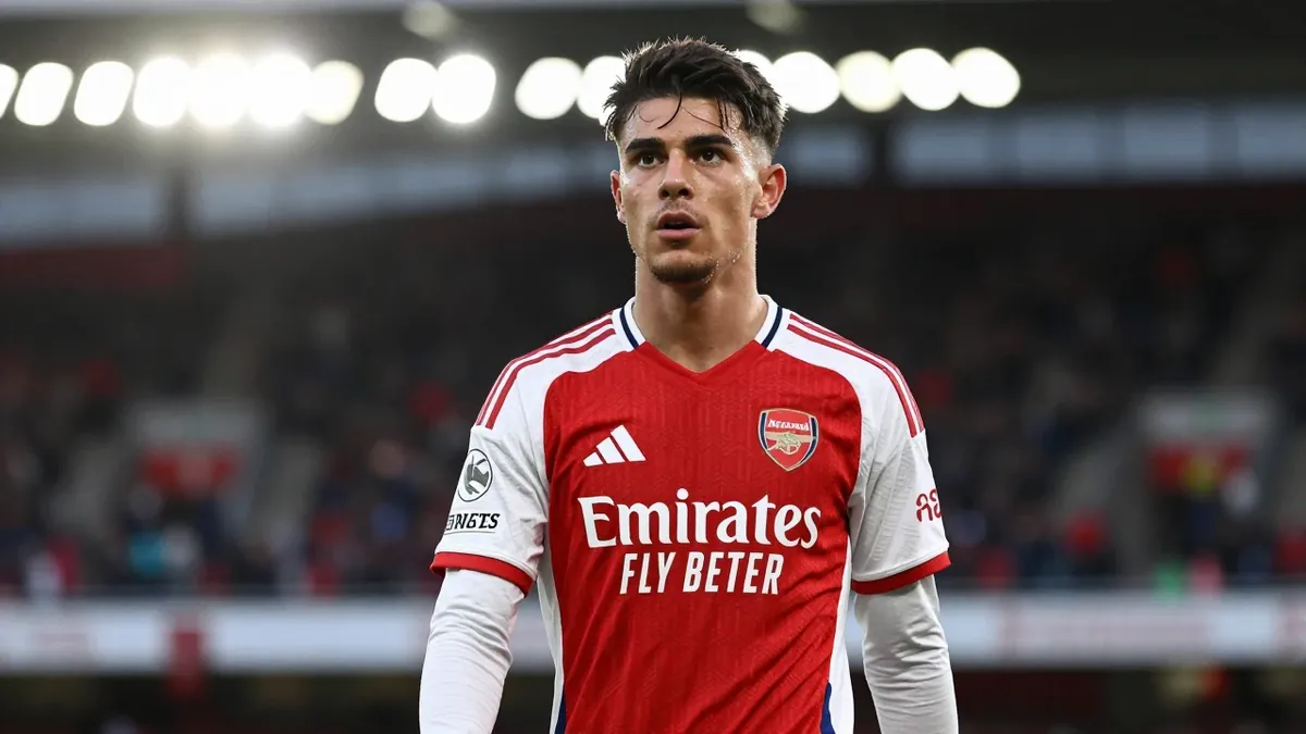 A waist-up photo of a young, athletic Arsenal player in a red and white kit, with a determined expression, taken with an...